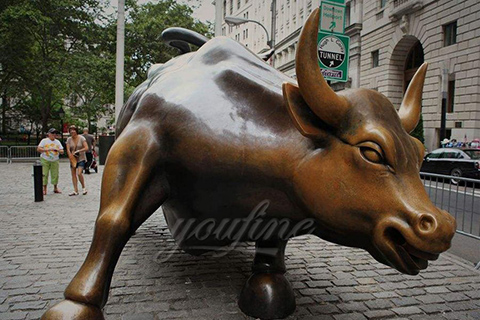 Classic bronze bull statues on wall street 
